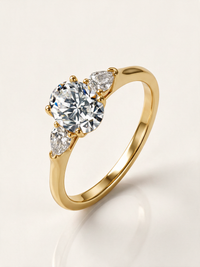 Oval Three-Stone Moissanite Ring with Pear Side Stones – 1.5ct