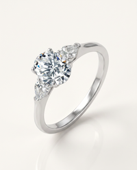 Oval Three-Stone Moissanite Ring with Pear Side Stones – 1.5ct