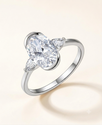 Oval Three-Stone Moissanite Ring with Pear Side Stones – 2.5ct