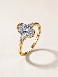 Oval Three-Stone Moissanite Ring with Pear Side Stones – 2.5ct